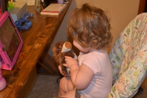 Jilly playing with one of her puppies. (Puppies are her favorite toy)